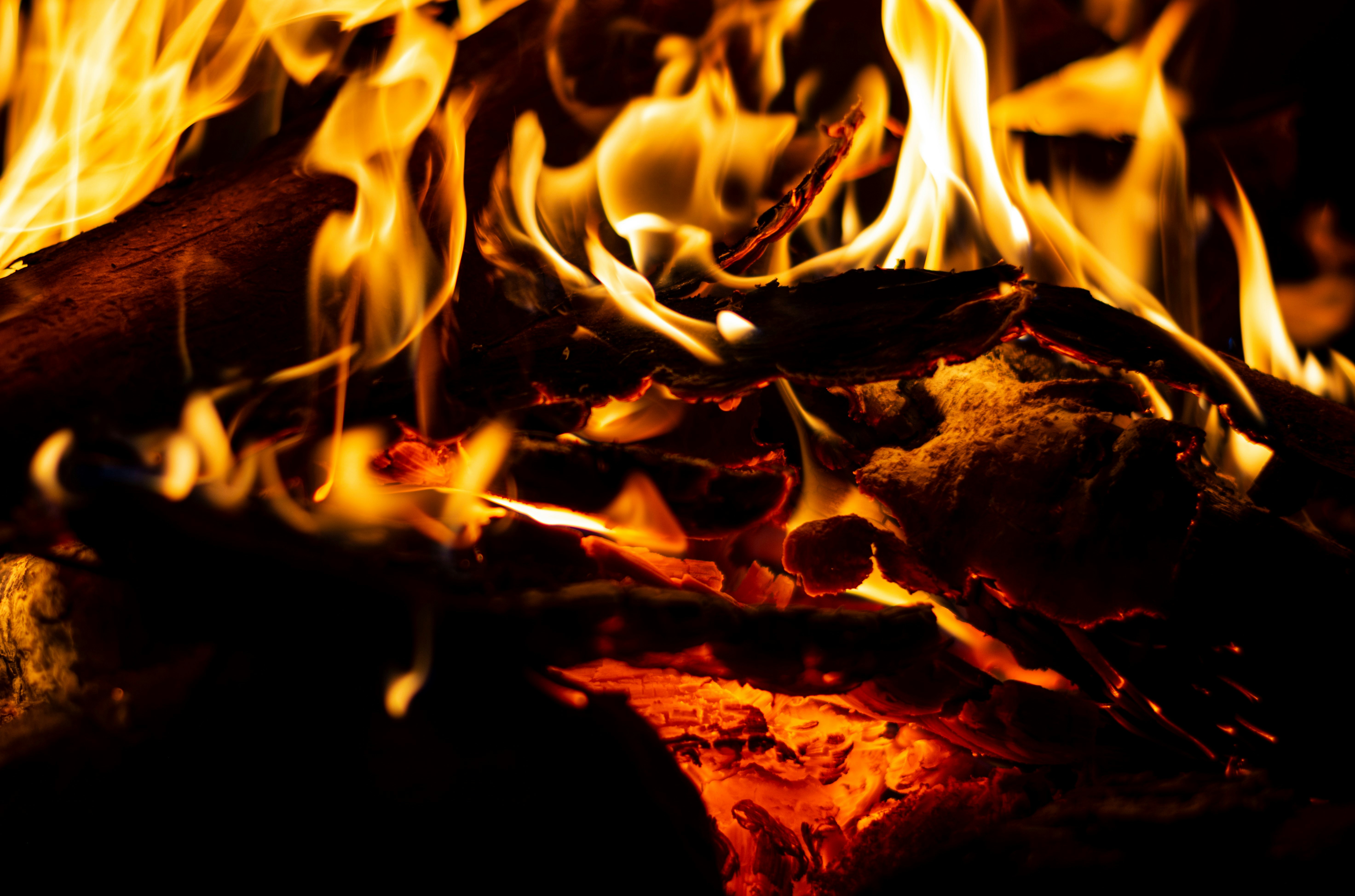 This is a close-up photo of a fire burning taken by Vitali Adutskevich (available on Unsplashed.com). It is a symbolic image representing human behaviors like complacency, ignorance, neglect, drift, evasion, and resistance (acronym: CINDER) that erode security programs.